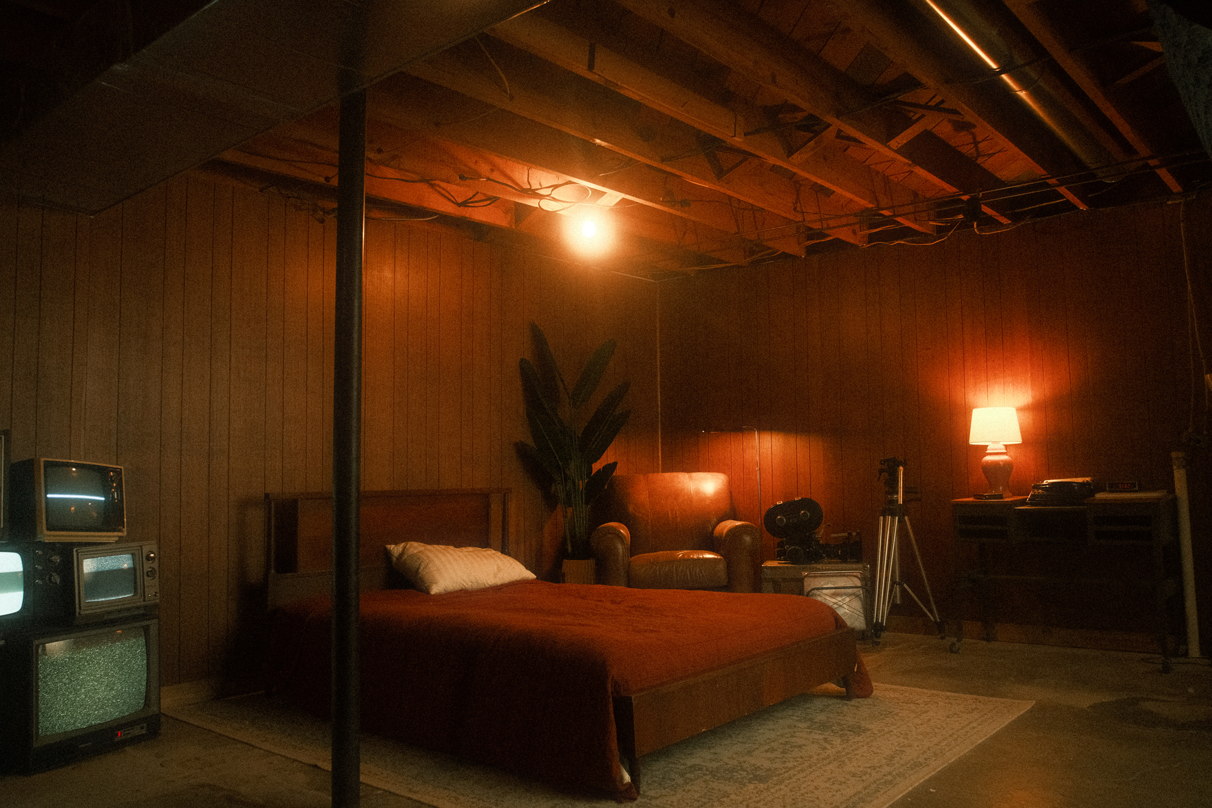 A chair in the middle of a cinematic, dark space