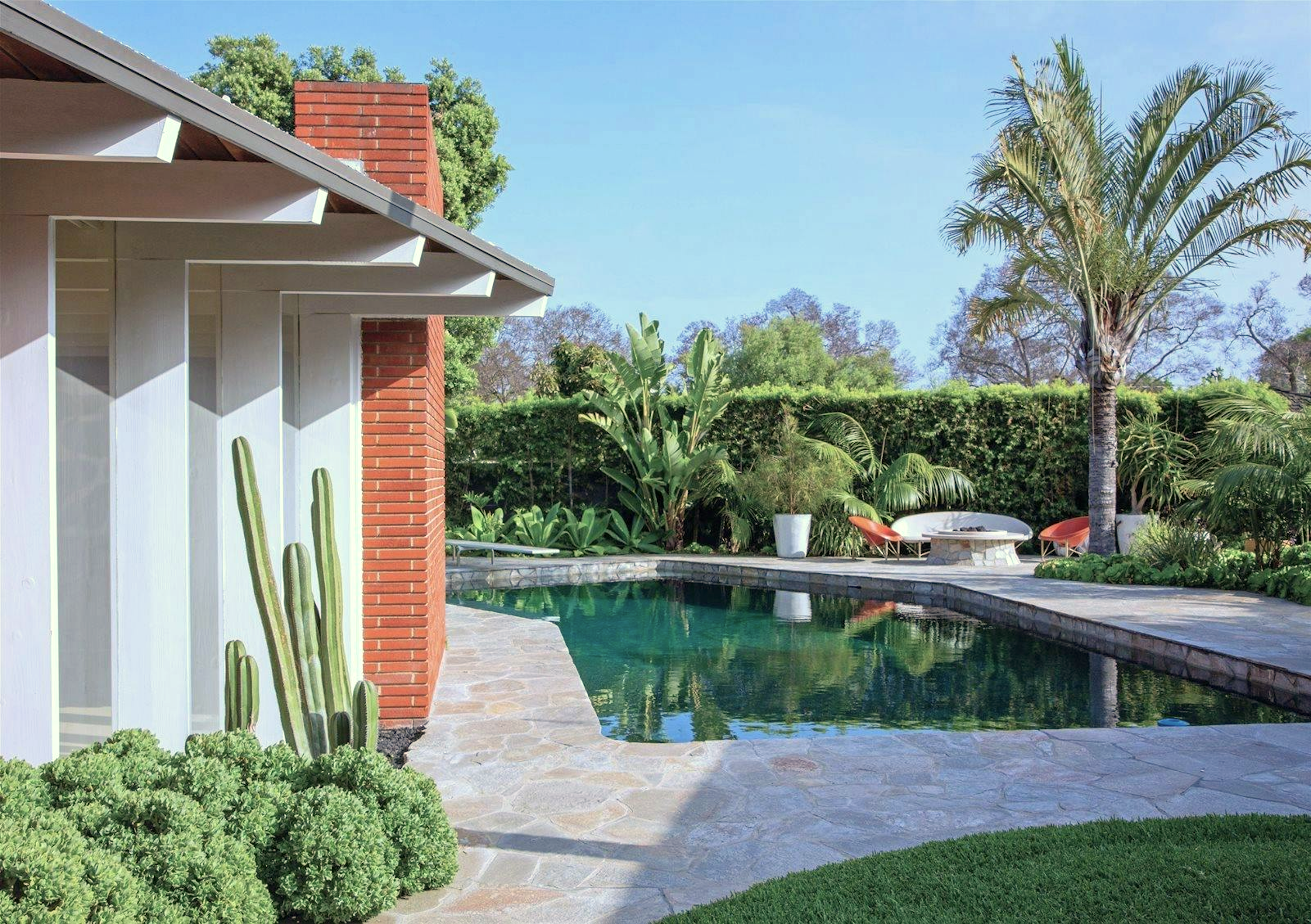 Bright Mid-Century Modern Home With Indoor Koi Pond, Large Pool and Outdoor Space