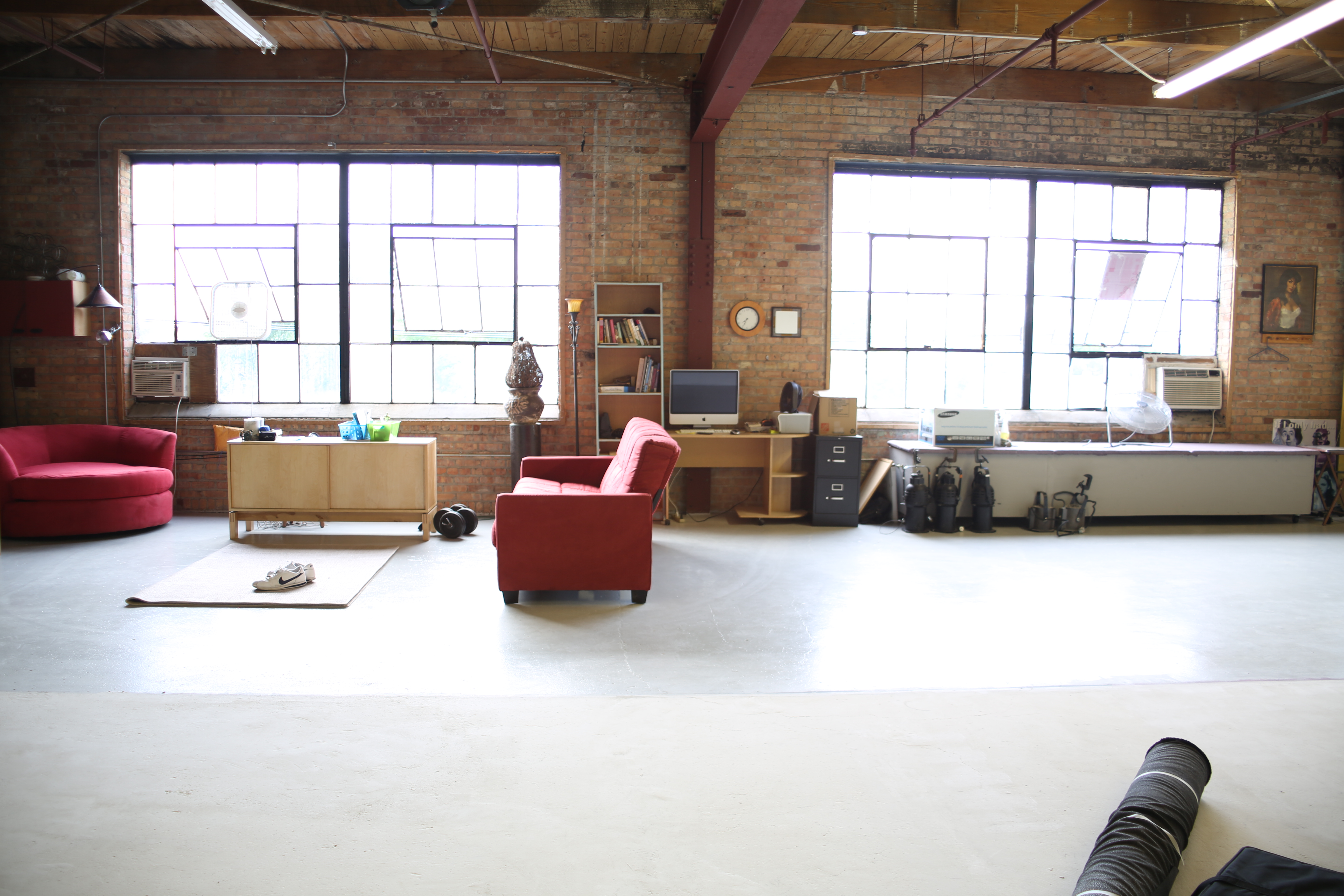 (Roc Star Studio) Bright high ceiling photography and video studio loft with exposed brick and plenty of natural sun light. 
