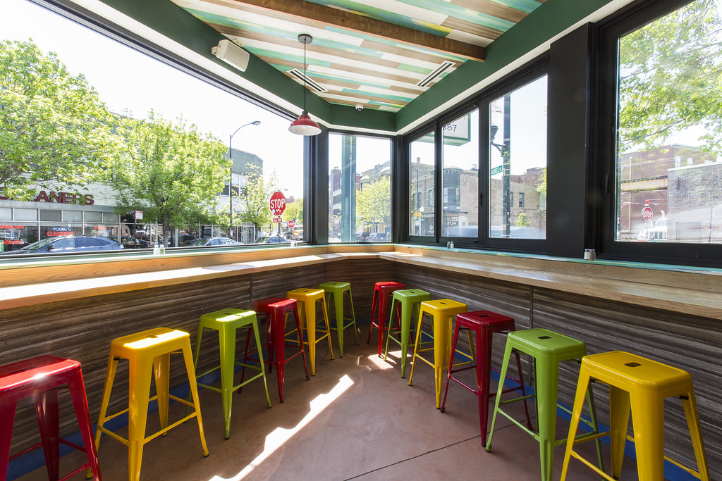 Large Latin-American restaurant on sunny corner in Bucktown