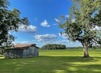 Hundreds of acres of farmland, numerous rustic barns and pure beauty, less than an hour from Nashville