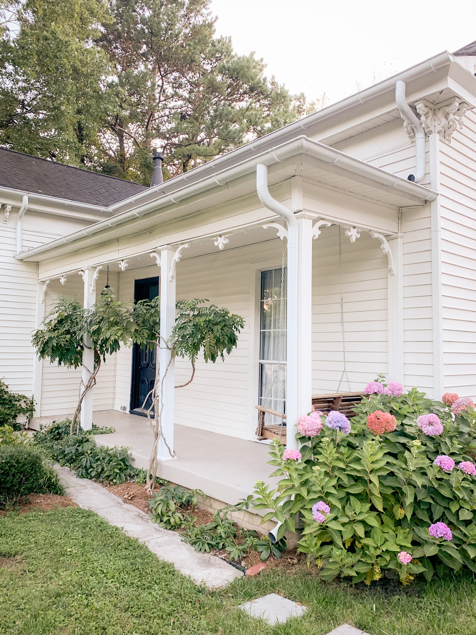 Eclectic Victorian in Downtown Franklin with white baby grand piano and huge outdoor fireplace