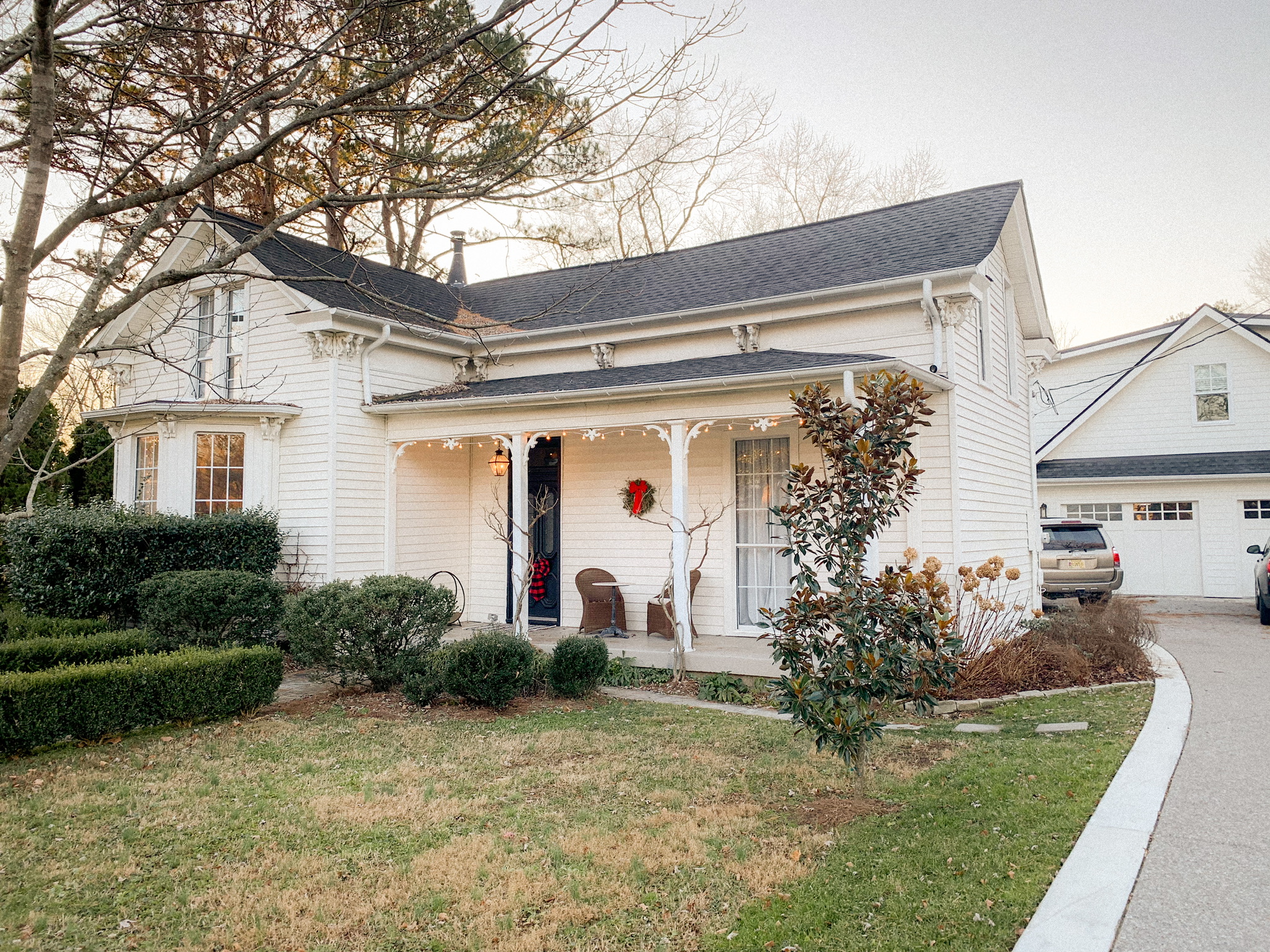 Eclectic Victorian in Downtown Franklin with white baby grand piano and huge outdoor fireplace