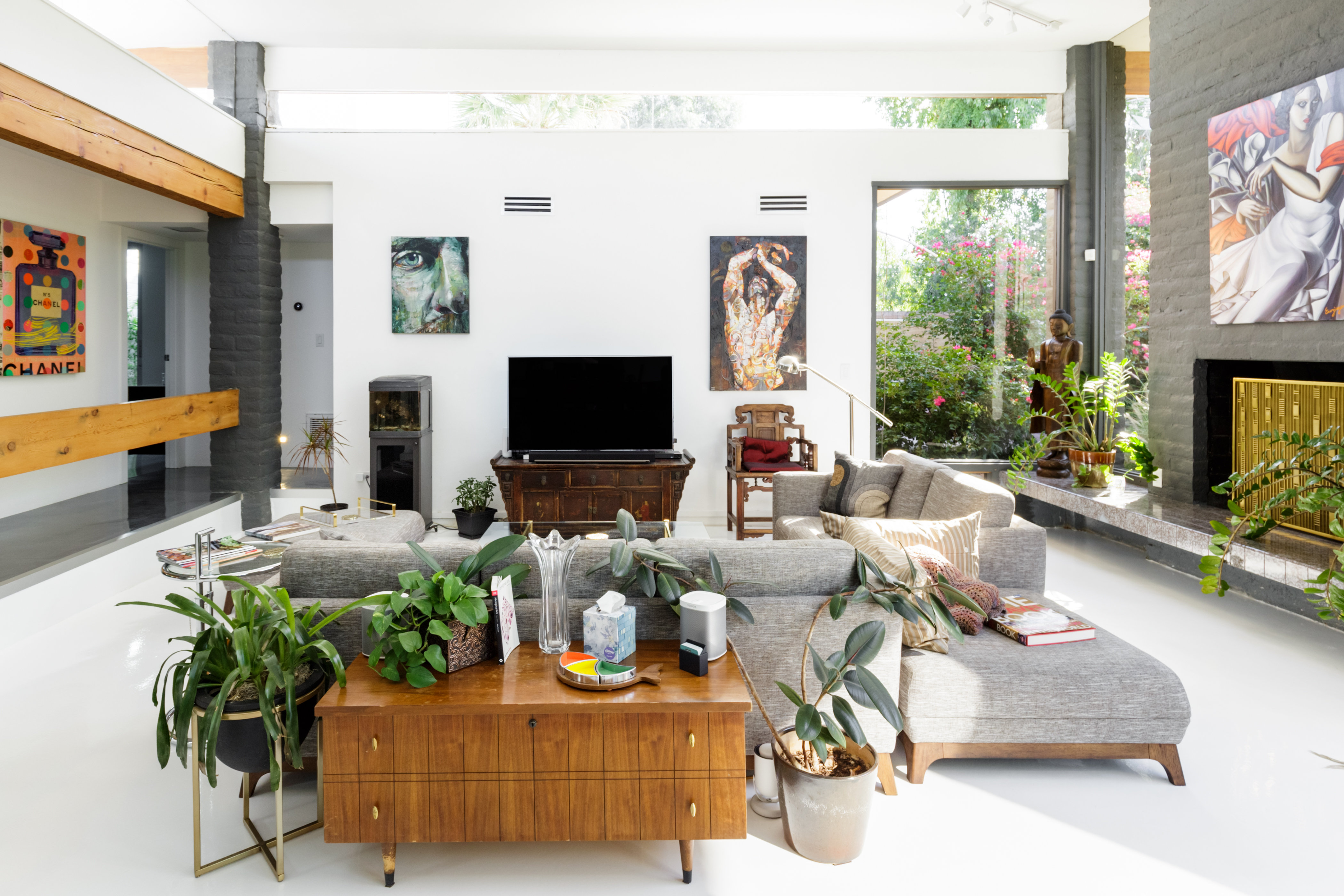 Mid-Century Luxury Villa with lush green landscaping