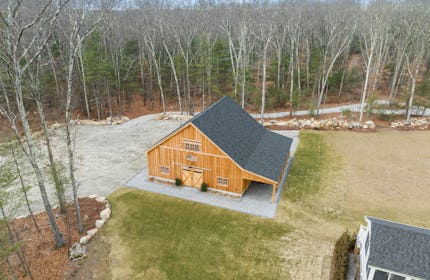 Spectaular rustic yet modern barn set on a 10.5 wooded acre lot in New England