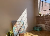 Sunny Studio with White Walls and Exposed Brick