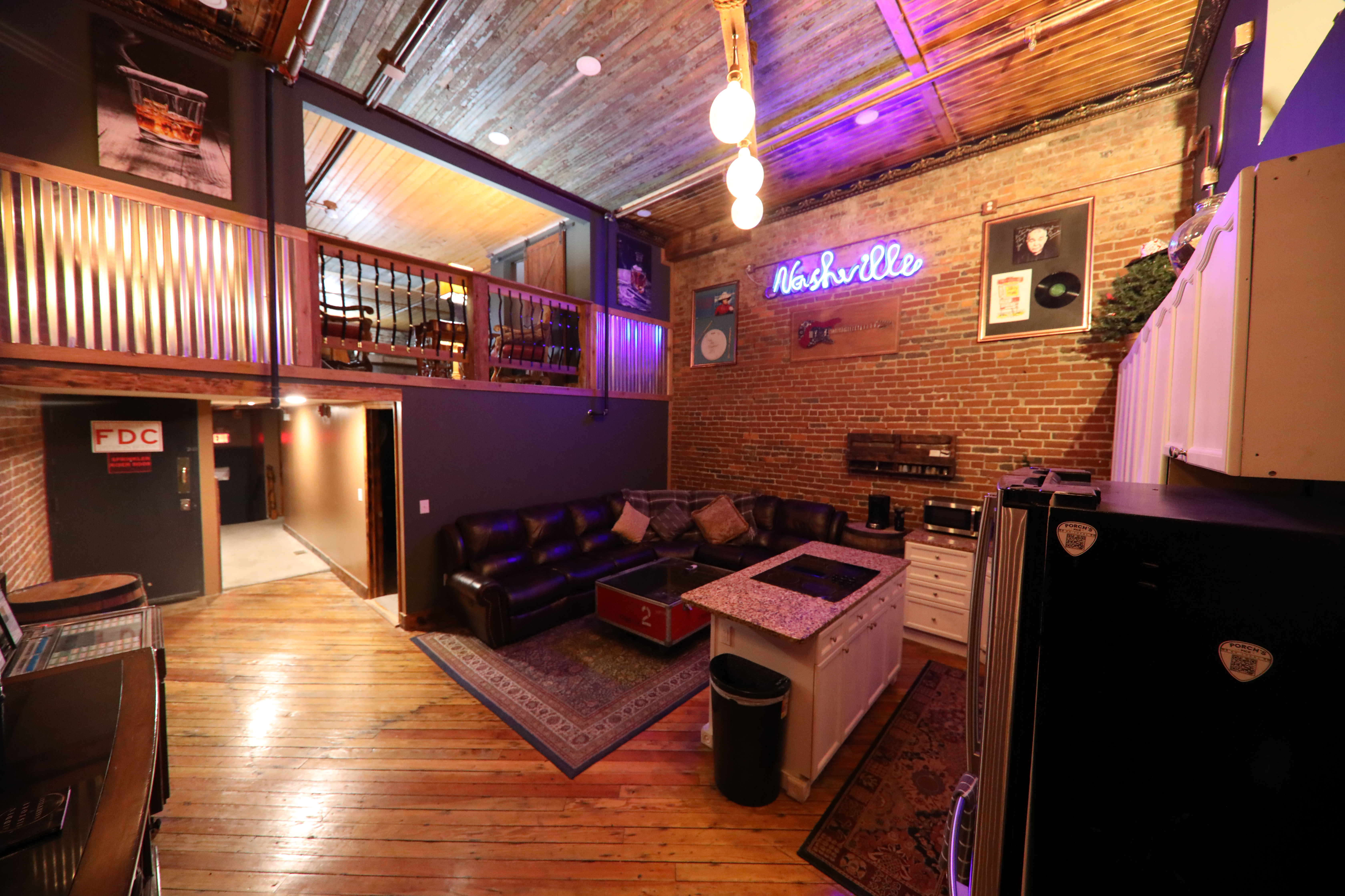The Speakeasy-- 2500 SF Downtown 18' Brick Walls, Rockstar Memorabilia