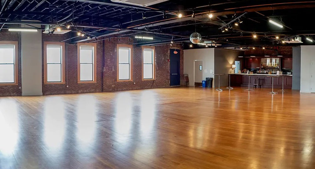 Bright Industrial Ballroom with Modern Bar