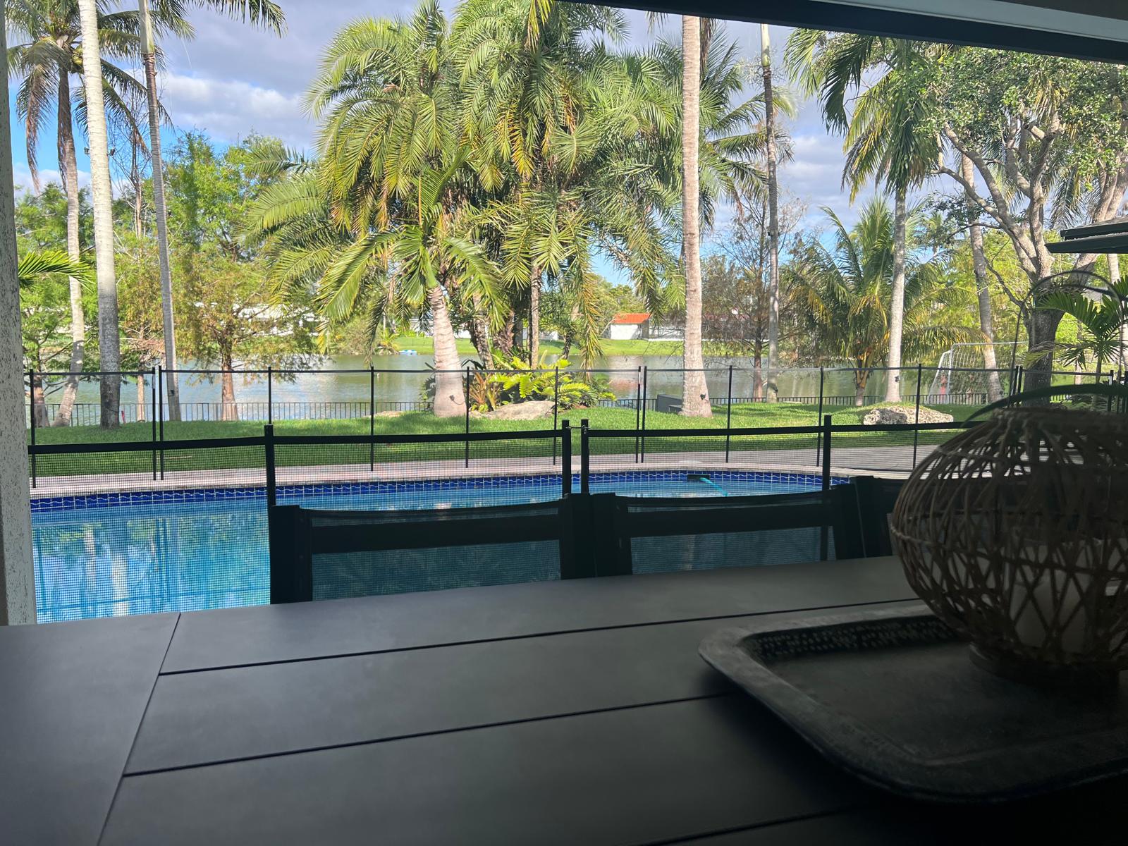 House with a big and nice landscaped backyard with a big lake