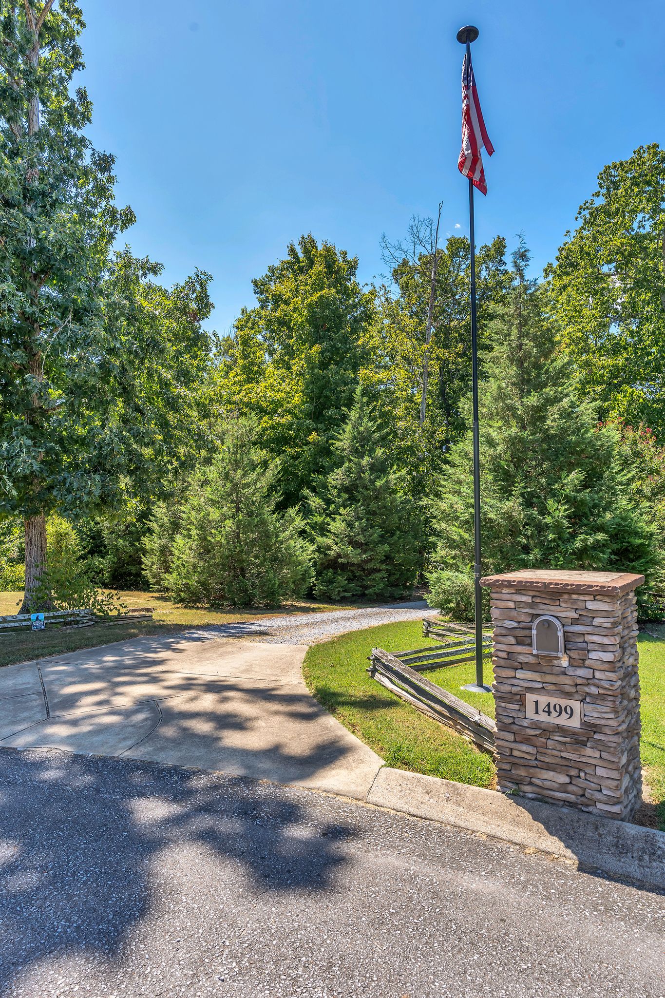 Wooded acreage with outbuildings and open plan home