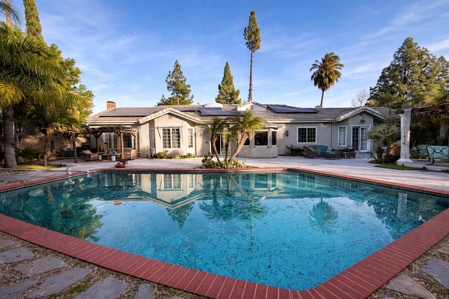 Resort-Style Mediterranean Backyard with Pool, Tiki Bar & Lush Landscaping